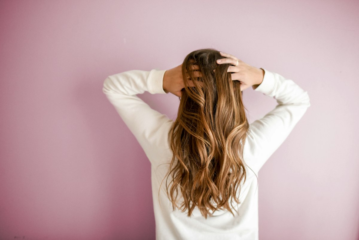 Beauty professional attending in a salon with natural light